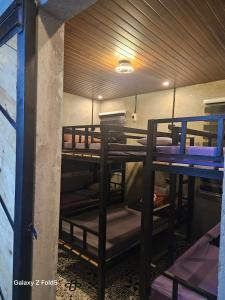 a group of bunk beds in a room at Casa Tolentino Tagaytay - Full house in Tagaytay