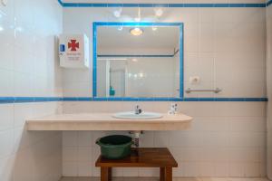 a bathroom with a sink and a mirror at Appartment Zomero, SEAVIEW & WIFI & POOL in Costa Del Silencio +16 photos