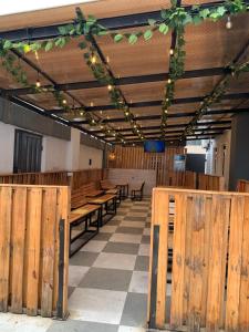 a dining room with wooden tables and lights on the ceiling at Twinny properties in Lagos +22 photos
