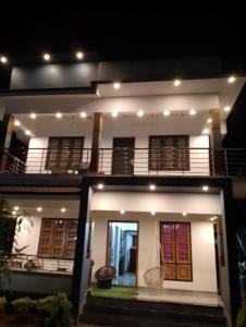 a view of a house at night at Eha Mundro Island Homestay in Munroe Island