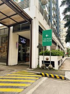 a two million tree walks sign in front of a building at Kai cabins NAIA 3 walking distance Newport City Pasay in Manila