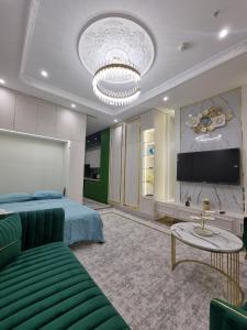 TV a/nebo společenská místnost v ubytování Tashkent Nest one