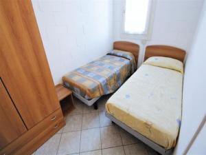 Ένα ή περισσότερα κρεβάτια σε δωμάτιο στο Holiday Home in Rosolina Mare near Beach