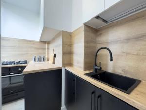 Кухня или мини-кухня в Przytulny apartament 2 pokojowy ma Wójtostwie
