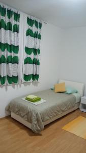 a bed in a room with a window at Apartment Plitvice in Starigrad-Paklenica