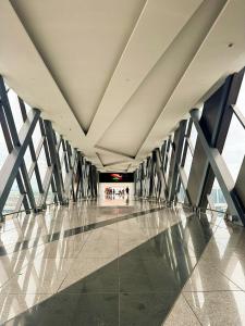 a hallway of a building with a large ceiling at Kai cabins NAIA 3 walking distance Newport City Pasay in Manila