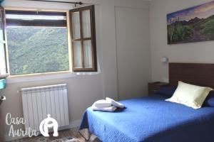 Ένα ή περισσότερα κρεβάτια σε δωμάτιο στο Casa Aurita