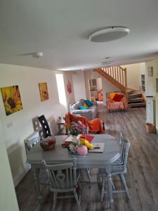 a living room with a table and chairs at The Farmhouse in Spinans Cross Roads