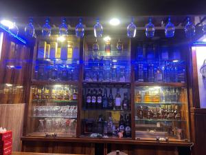 a bar filled with lots of bottles of alcohol at Hotel Kandara in Pokhara