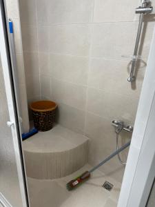 a bathroom with a shower with a toilet in it at Martil appartement avec vue sur mer in Martil +26 photos