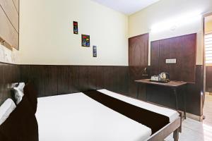 Ένα ή περισσότερα κρεβάτια σε δωμάτιο στο Hotel O cozy suits +32 φωτογραφίες