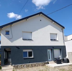 a house with black and white at NG-Global Home in Sierentz