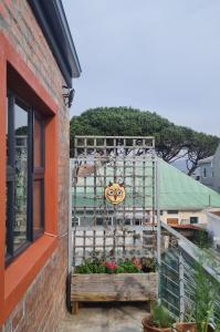 a building with a gate with a pumpkin face on it at Your home in the Cape in Cape Town +2 photos