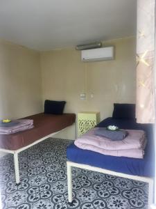 Una cama o camas en una habitación de KiKi HOSTEL