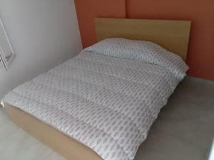 a small bed in a corner of a room at Le Baou fully renovated 2025 in Sanary-sur-Mer +4 photos