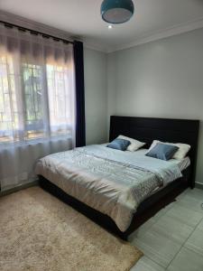 Ένα ή περισσότερα κρεβάτια σε δωμάτιο στο Jackies place