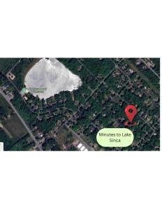 an overhead view of a lake with a red marker at Theater*2 Game Rooms *Sauna *Hot Tub*Fall Specials in Blakeslee