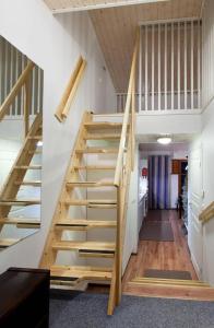 a staircase in a house with wooden risers at Raito Apartment in Saariselka