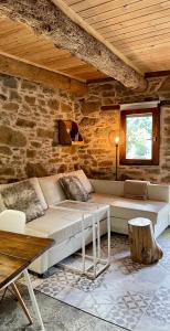 a living room with a couch and a table at Casa Rural Arlanza13 in Arlanza