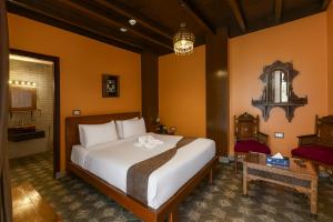 a bedroom with a large bed and a bathroom at Gamaleya Boutique Hotel in Cairo +48 photos