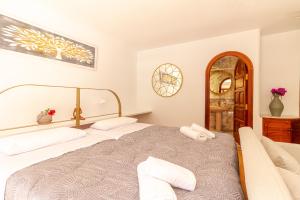 a bedroom with a bed and a chair in it at Los Penones Experiences A - Solo Adultos in El Sao +37 photos