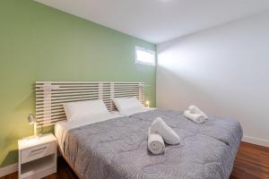 a bedroom with a bed with two towels on it at Los Penones Experience B - Solo Adultos in El Sao +38 photos