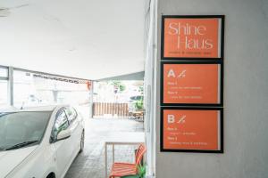 a white car parked in front of a restaurant at Dec Room at Shine Haus BangSue in Bang Su