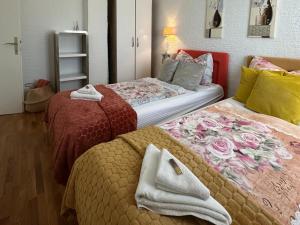 two beds sitting next to each other in a room at Villa Saranda in Supetarska Draga +69 photos