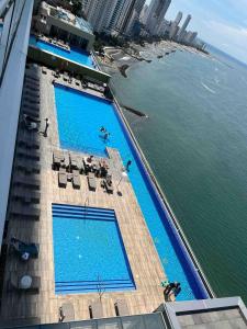 an overhead view of two swimming pools on a building at Cartagena Colombia- h2 Hyatt condo-Bay view in Cartagena de Indias