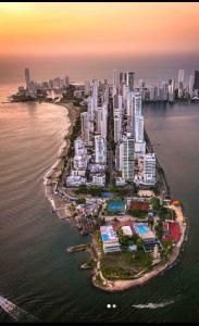 an island in the ocean next to a city at Cartagena Colombia- h2 Hyatt condo-Bay view in Cartagena de Indias