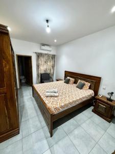 Postel nebo postele na pokoji v ubytování Villa mamisco 4 chambres 15 minutes de Saly centre