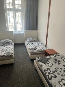 Ένα ή περισσότερα κρεβάτια σε δωμάτιο στο Loftel v centru Ostravy +11 φωτογραφίες