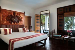 Voodi või voodid majutusasutuse Turtle Bay Boutique Hotel toas