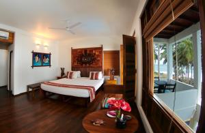 Voodi või voodid majutusasutuse Turtle Bay Boutique Hotel toas