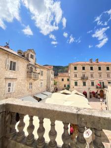 a view of a city from a balcony at Private room Shared bathroom and kitchen in Kotor