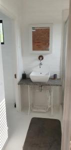 a white sink in a bathroom with a window at Quilla Quarters in Plumstead +22 photos