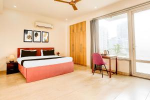 Ένα ή περισσότερα κρεβάτια σε δωμάτιο στο Hotel O AR SUITES