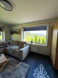 Postel nebo postele na pokoji v ubytování Apartamenty Premium Biały Dunajec , Jacuzzi , Sauna, Darmowy parking, Kominki w apartamentach, Widok na góry