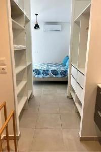 Ένα ή περισσότερα κρεβάτια σε δωμάτιο στο BnB MARTINIQUE, sejour Caraibes en 1ere ligne, marina Fort de France