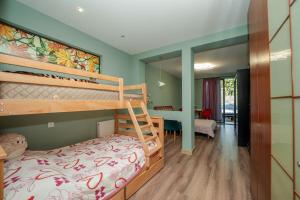 a bedroom with two bunk beds and a living room at Villa Ananuri in Ananuri +150 photos