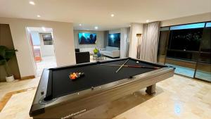 a large living room with a pool table at Lux Lleras l Daily Cleaning l AC l Visitrs Allowed in Medellín
