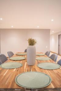a long table with a vase on top of it at Lux Lleras l Daily Cleaning l AC l Visitrs Allowed in Medellín