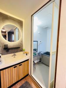 a bathroom with a sink and a mirror at Stay Narimasu - 3rooms Apartment, 4min to Narimasu station, 1min to Donki in Tokyo +60 photos