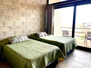 Postel nebo postele na pokoji v ubytování Vichayito Casa Wiñay