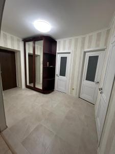 an empty room with a hallway with two doors at Двохкімнатна квартира біля моря in Chornomorsk