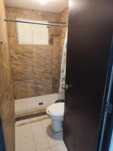 a bathroom with a toilet and a shower at Departamento en zona dorada in Saltillo
