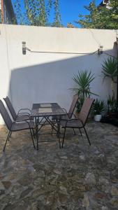a patio with a table and two chairs at D&D ROOM in Bucharest +2 photos