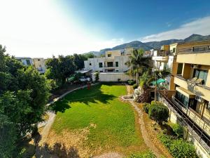 an aerial view of a yard with buildings at Capital Family Lodges Islamabad in Islamabad