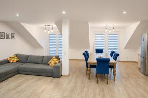 a living room with a couch and a table at Apartament 45 in Olszewnica Nowa