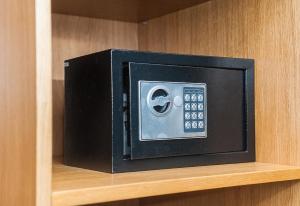 a microwave oven sitting on top of a shelf at Beehive Hotel in Odesa